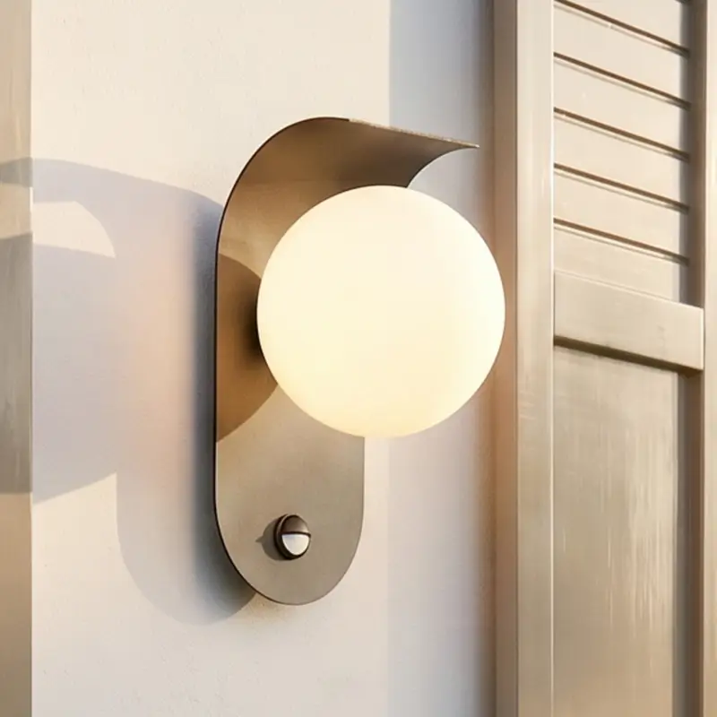 Billig Lindby LED-utomhusvägglampa Lacie, sensor, svart/vit, aluminium